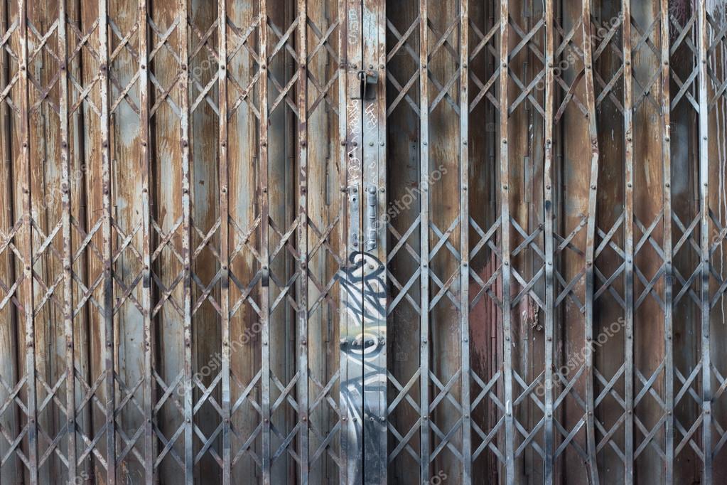 Asian rusty folding doors or traditional gate. Old steel rusty door ... Asian rusty folding doors or traditional gate. Old steel rusty door ...