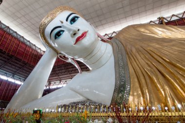 Big Buddha, Shwethalyaung Reclining Buddha or Chauk htat gyi reclining buddha with big and beautiful eyes in yangon. clipart