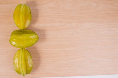 Star apple or averrhoa carambola on wooden table. Fresh star apple fruit on table.