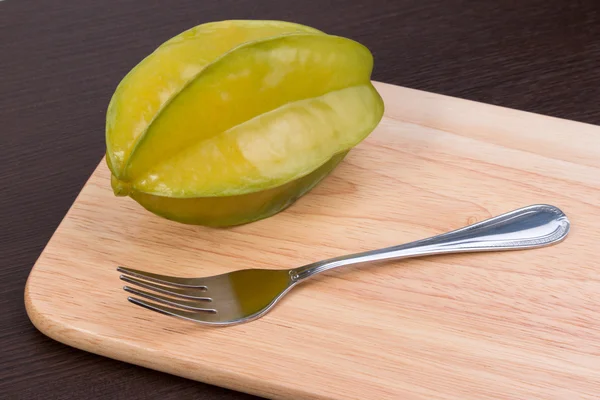 Star apple and averrhoa carambola on wooden block. Fresh star apple fruit on wood table. — Stock Photo, Image