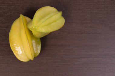 Star apple or averrhoa carambola on wooden table. Fresh star apple fruit on table.
