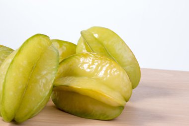Star apple or averrhoa carambola on wooden table. Fresh star apple fruit on table.