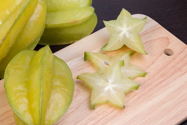 Star apple and averrhoa carambola on wooden block. Fresh star apple fruit on wood table. — Stock Photo, Image