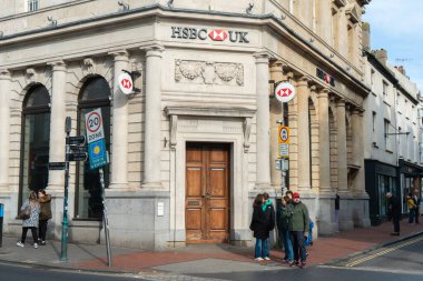 Brighton, England-12 December,2019: The entrance of HSBC bank branch office in the city town of Brighton, UK with beautiful old vintage building.
