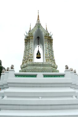 Golden isosceles structure, Delicate painted of Thai Temple Door Entrance and Lion Historic Chinese stone sculpture of a Chinese warrior sculpture in Wat Pho Buddhist Temp