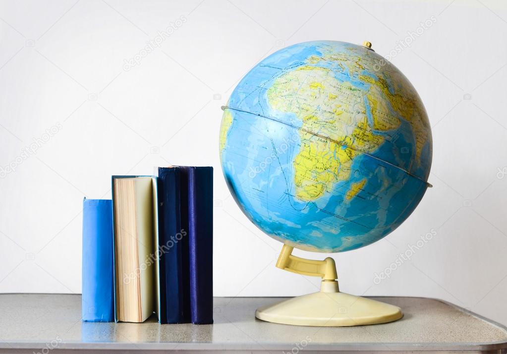 Vintage school globe and blue old school books