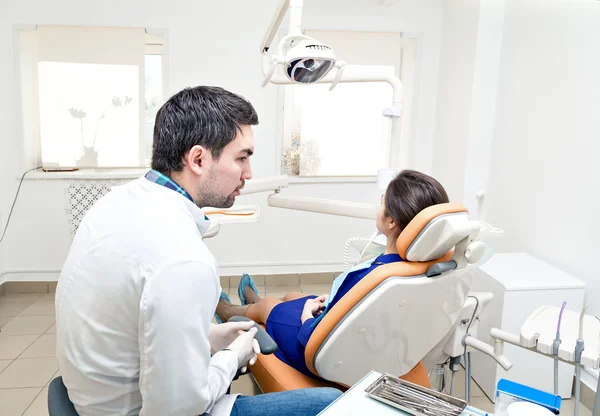 dentist in a dental clinic. The girl on reception at the dentists chair.