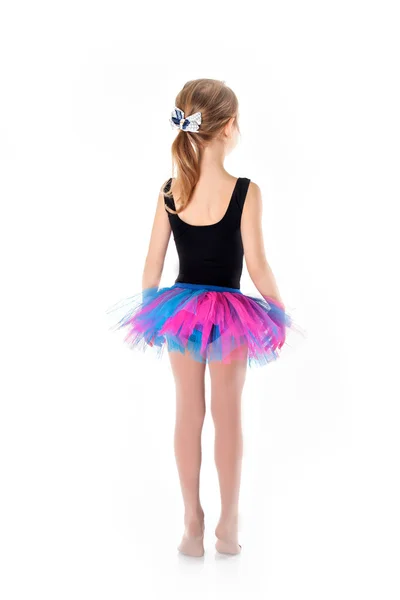 Kleine Ballerina in lila Rock auf weißem Hintergrund — Stockfoto