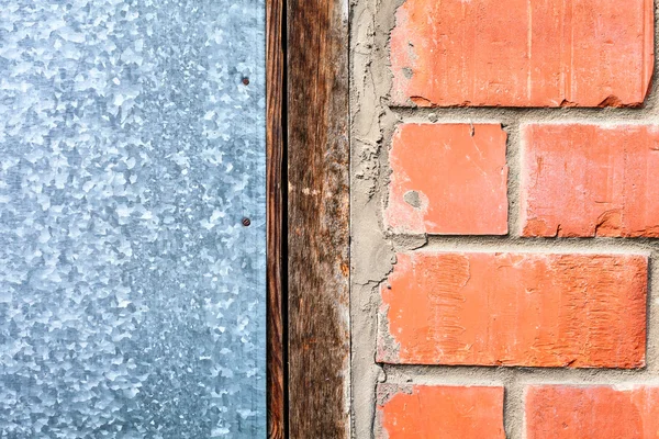 The combination of the four elements of building materials, hard wood texture, brick, cement, sheet metal mixed together on the wall of a country house. layer compound technology