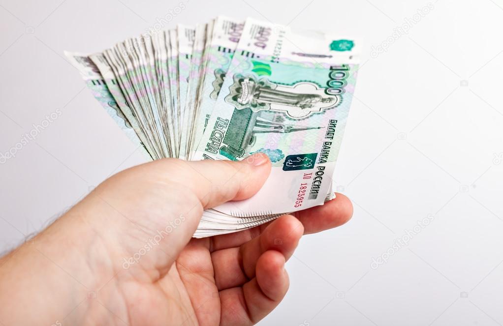 Bundle of bank notes Russia dignity thousand rubles in his hand