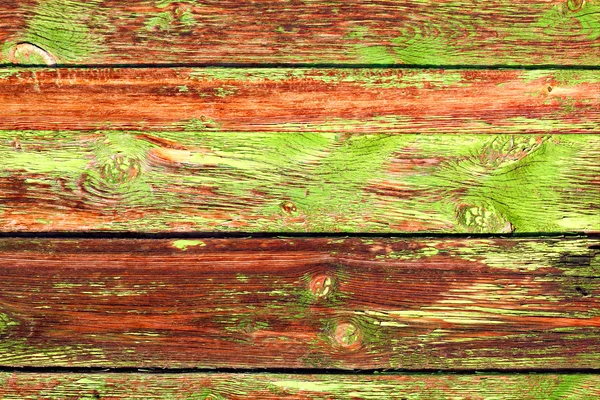 Vieux Grange planches en bois de couleur comme fond avec espace de copie. Fond rustique en bois ou texture de panneaux de bois peint. Des planches à fentes. Peinture verte et orange . — Photo
