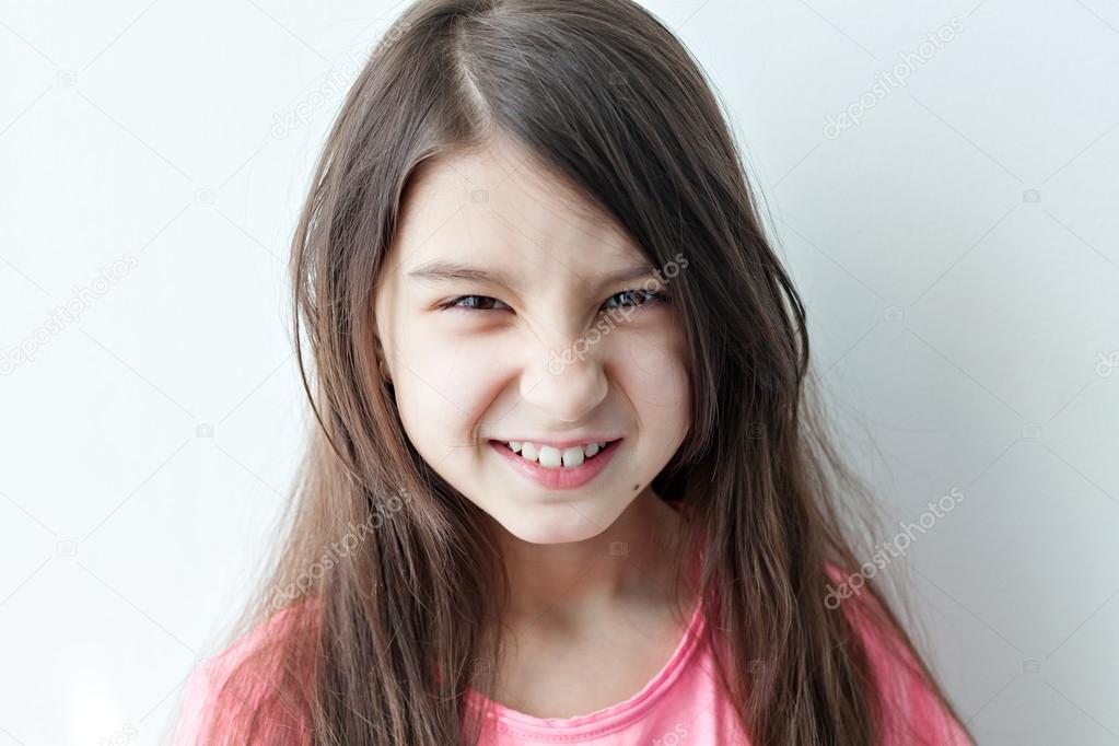 Little girl making a funny face. Stock Photo by ©Mukhomedianova 105875232