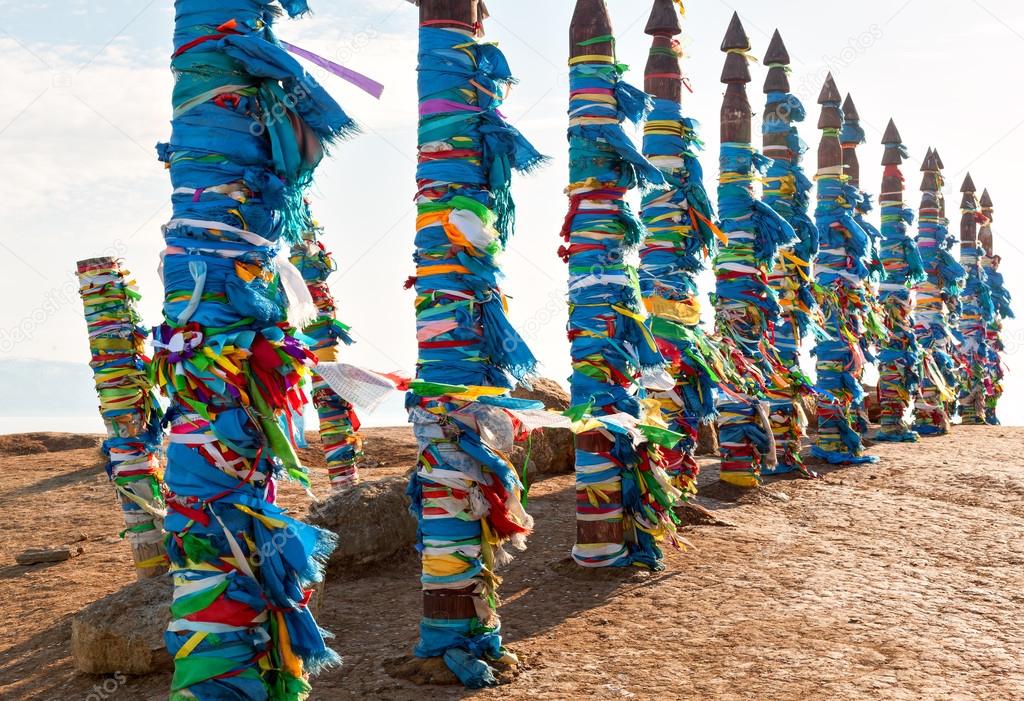 Traditional wooden poles to the hitching post serge. Prayer flags on Olkhon, Buryat Region, Russia, Siberia.