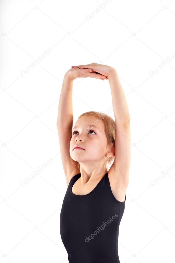 Cute Little girl doing gymnastics exercise