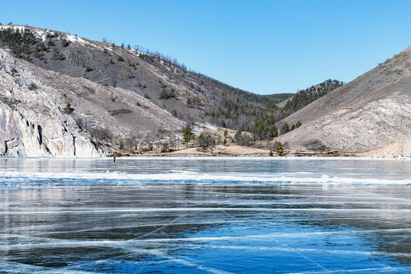 Blue ice and cracks on the surface of the ice Lake Baikal, Siber