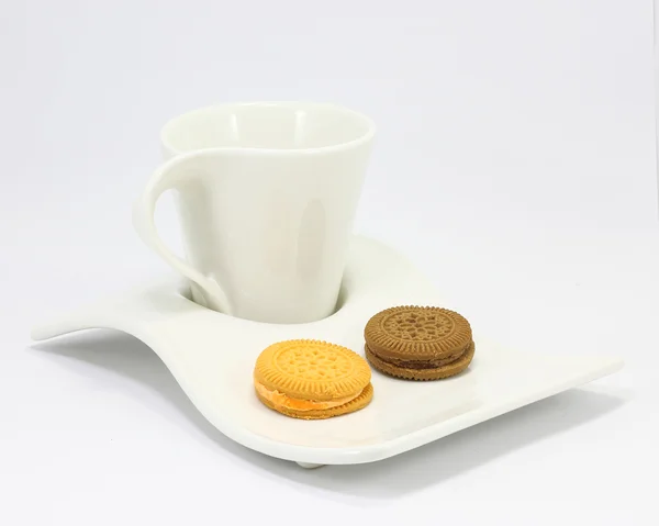 Chocolate Lemon cream sandwich biscuit cookie cup and saucer — Stock Photo, Image