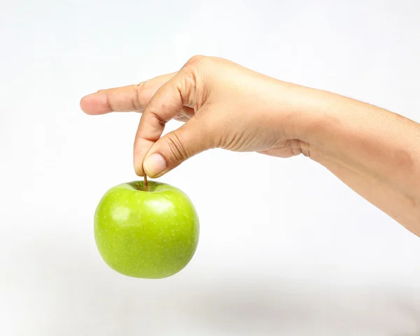 Zelené jablko, držel v ruce — Stock fotografie