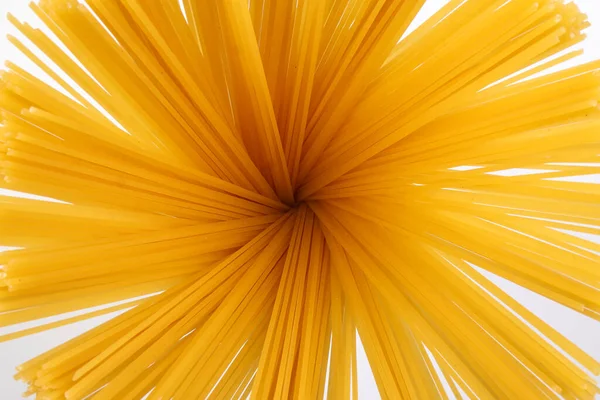Espaguetis Crudos Secos Fondo Blanco Flor Flor Sol Brillo Patrón —  Fotos de Stock