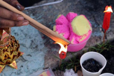 Chinese hungry ghost festival burning flame fire colourful variety prayer paper joss money fake currency joss stick mini fag food fruit