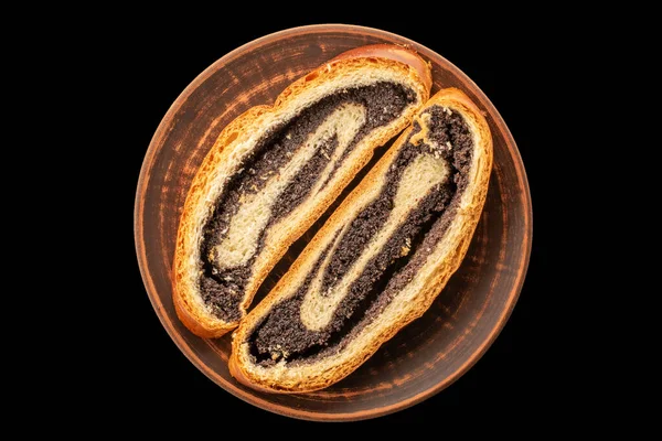 Siyah arka plan, makro, üst görünüm üzerinde izole haşhaş tohumlu kek.