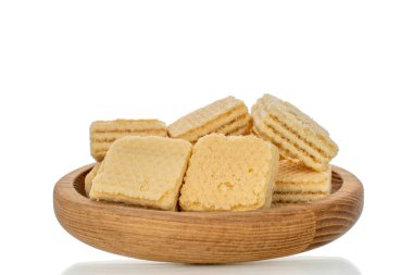 Beyaz arka planda izole edilmiş beyaz ahşap çatal bıçaklı vanilyalı waffle 'lar.,