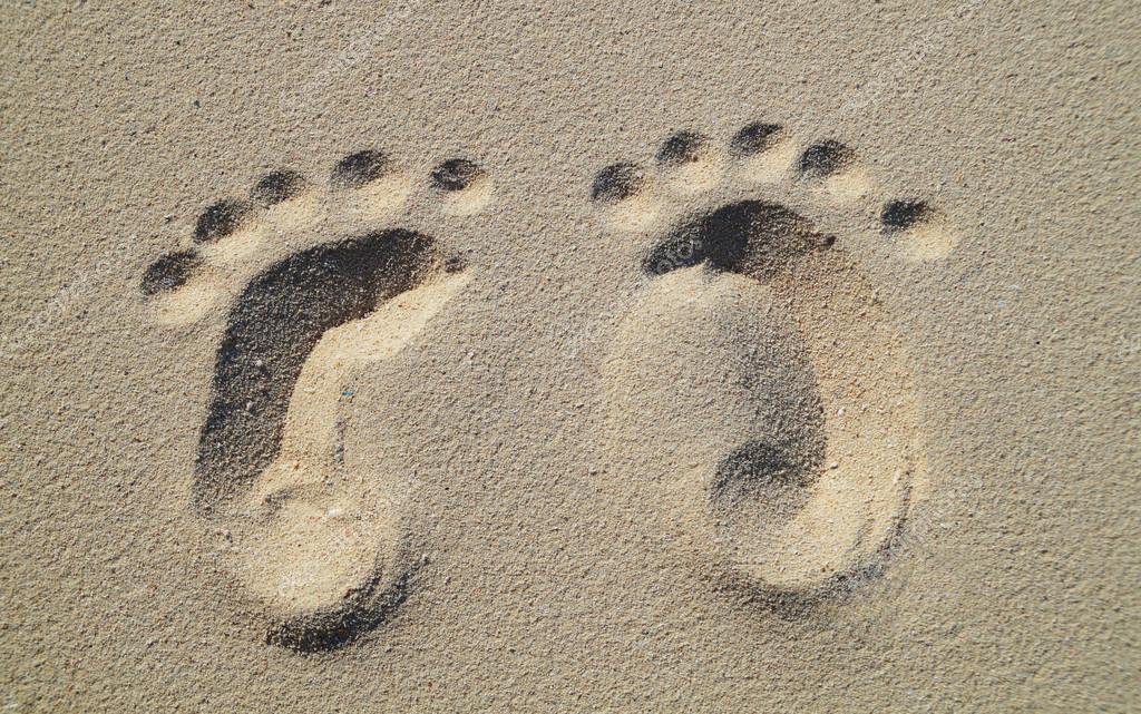 baby footprints in sand