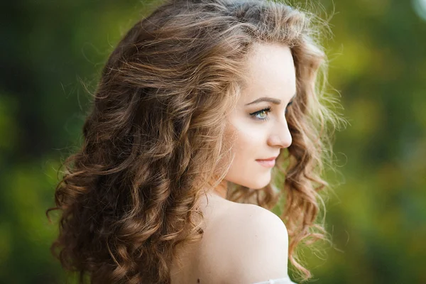 Sweet girl in a dress the color of rose quartz — Stock Photo, Image