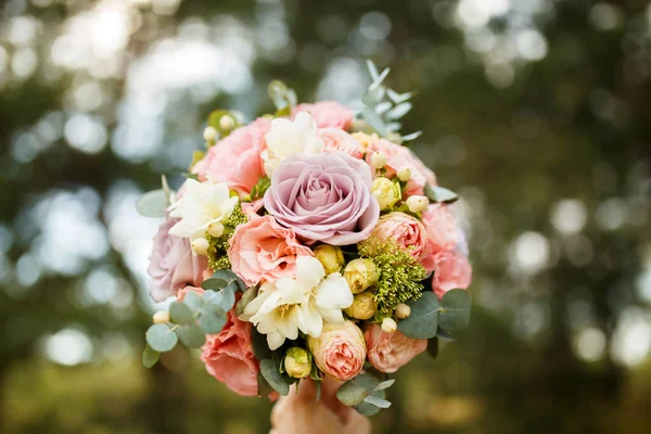 bouquet for the bride with pink peonies and eucalyptus