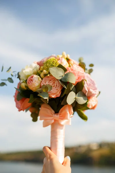 bouquet for the bride with pink peonies and eucalyptus
