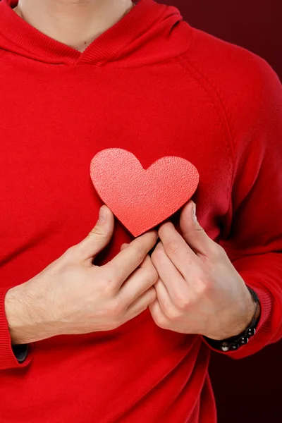 Valentine's Day. Man holding a red heart close up — Stock Photo, Image