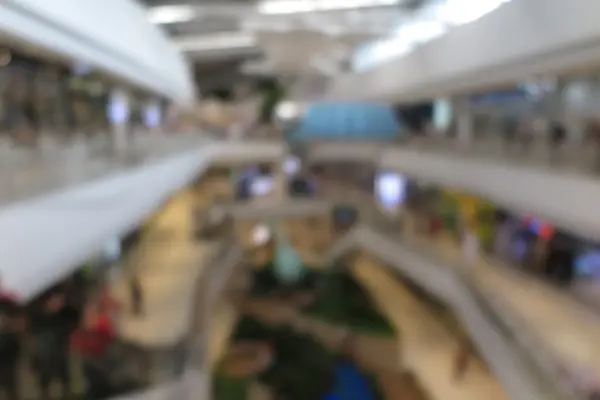 stock image Shopping mall, modern trade with people in blur background