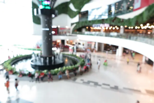 Shopping mall, modern trade with people in blur background — Stock Photo, Image