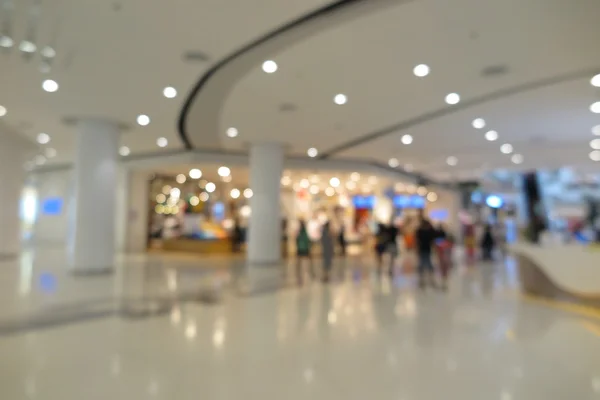 Shopping mall, modern trade with people in blur background — Stock Photo, Image