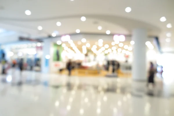 Centro comercial, el comercio moderno con la gente en el fondo borroso —  Fotos de Stock