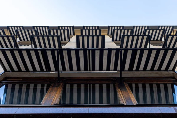 blue and white awnings over glass window in hotel, concept decoration for shading