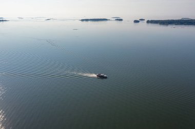 photo from a drone on a sunny morning Gulf of Finland and a sailing boat.