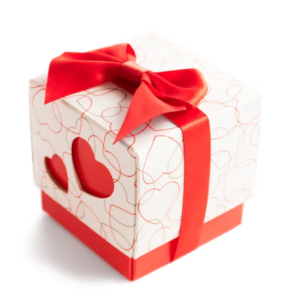 Gift box with two red hearts on side on white background — Stock Photo, Image