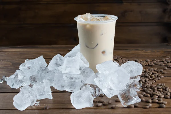 Ice coffee on wooden background — Stock Photo, Image