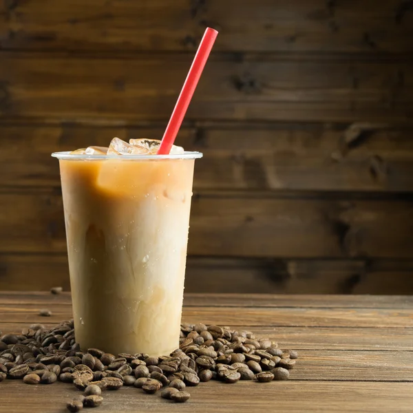 Ice coffee on wooden background — Stock Photo, Image