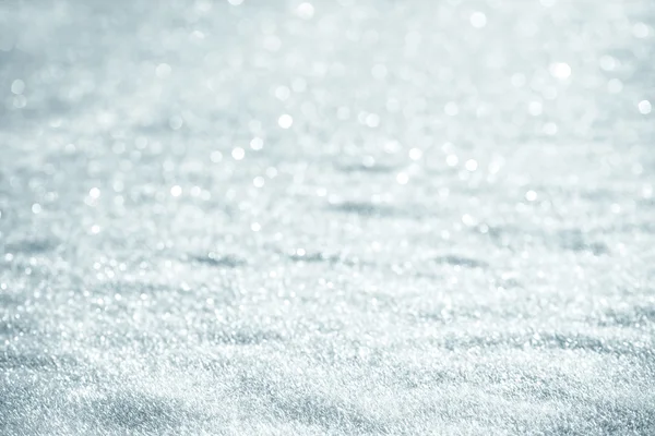 Güneşli bir günde kar taneleri ile kar arka plan