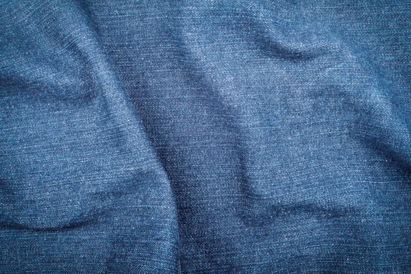 Textura de tecido de denim amassado, fundo têxtil — Fotografia de Stock