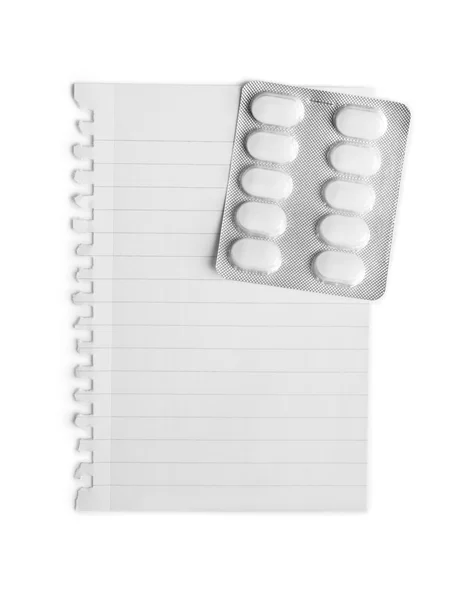 Packaging of pills attached to a sheet of paper — Stock Photo, Image