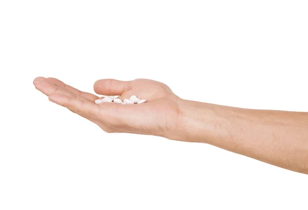 Hand holding pills isolated on white background — Stock Photo, Image