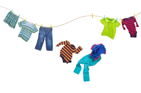 Laundry line with falling clothes on a white — Stock Photo, Image