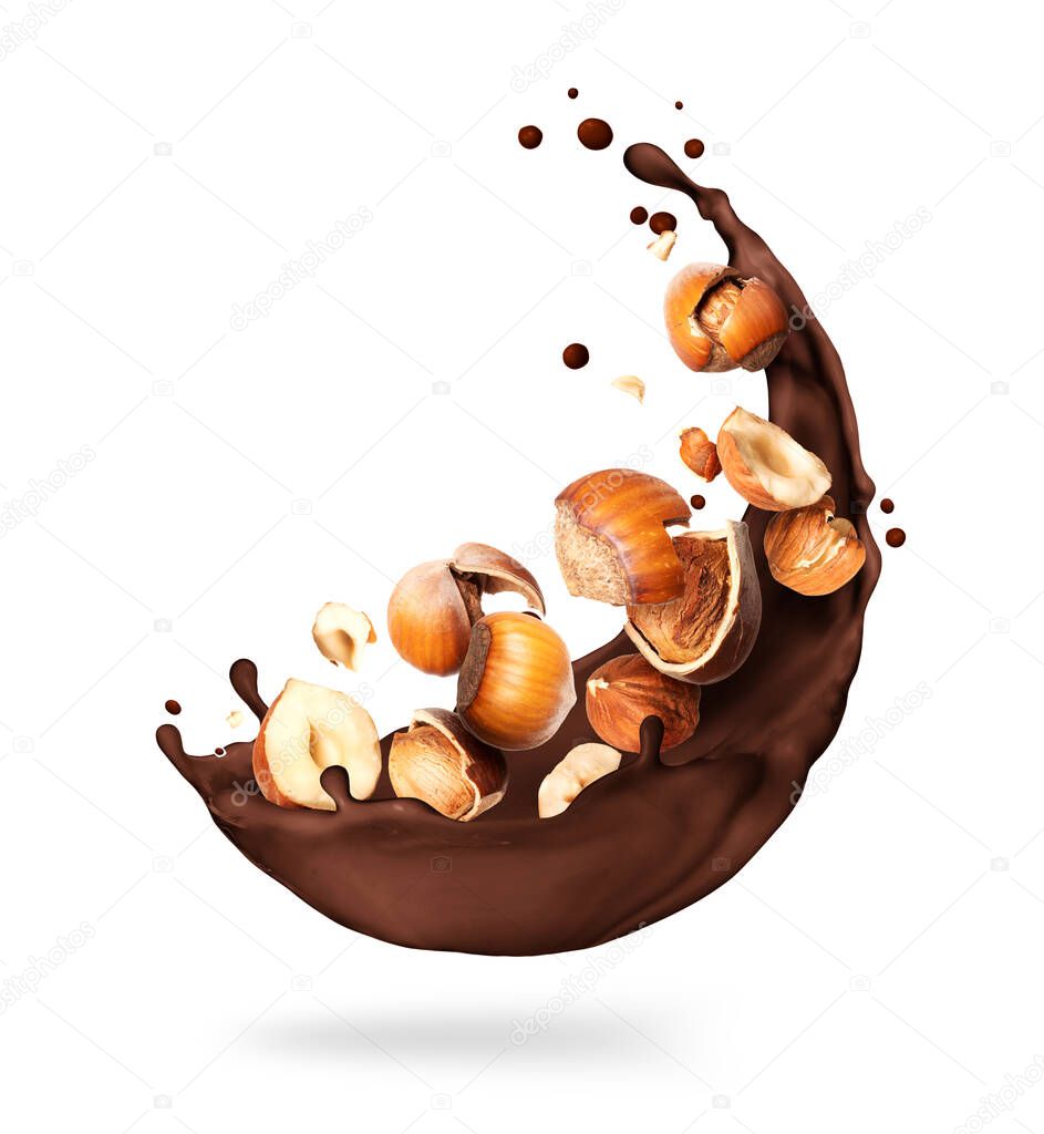 Chocolate splashes with crushed hazelnuts close-up on a white background
