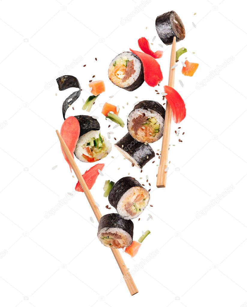 Fresh maki sushi rolls with ginger frozen in the air, isolated on white background