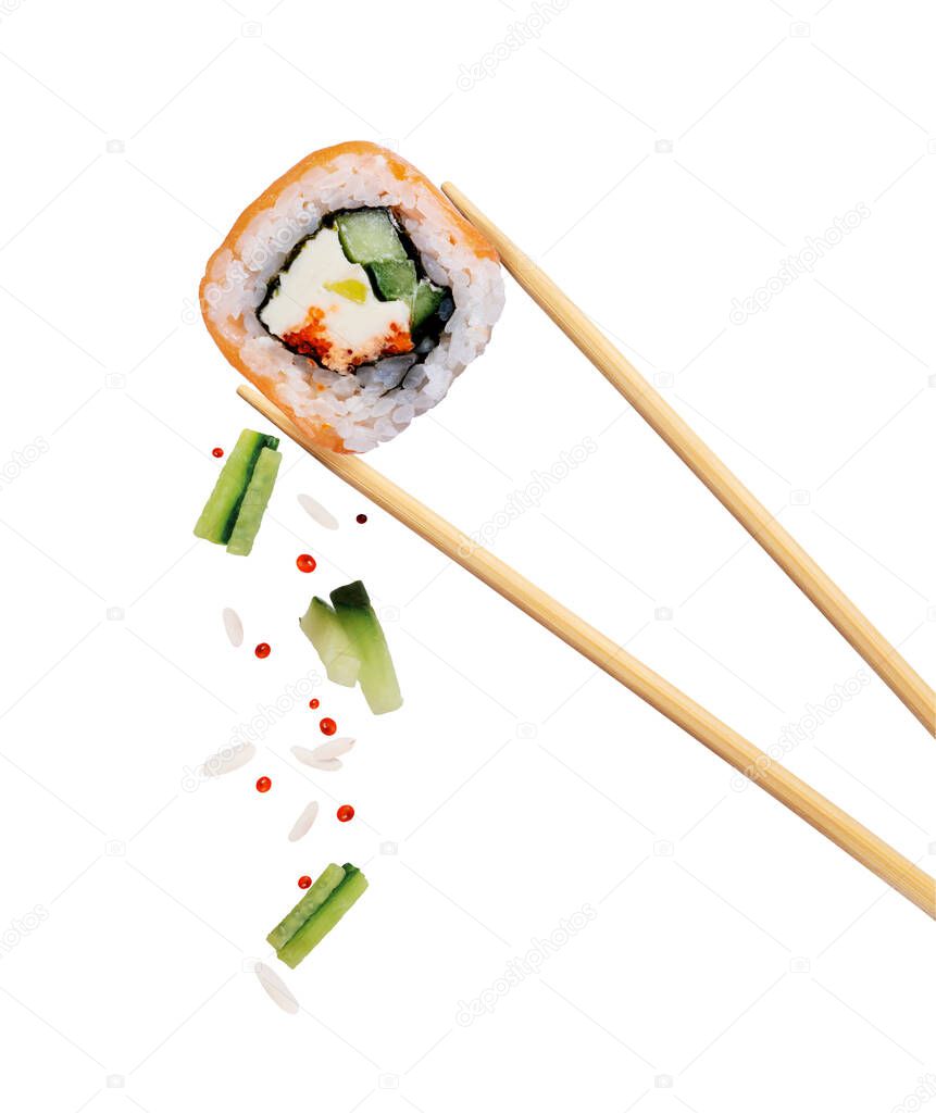 Fresh traditional japanese sushi with salmon and caviar between chopsticks, isolated on white background