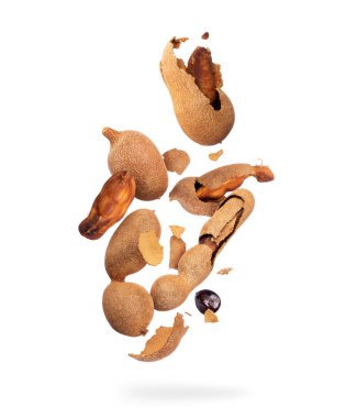 Crushed tamarind fruits close-up, isolated on a white background clipart