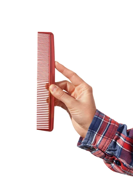 Comb in the hand isolated on white background — Stock Photo, Image
