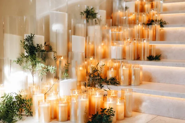 Romantic Wedding Table Top Layout Decor with large lush floral bouquets including white roses, ranunculus, persian buttercups, white orchids and candles — Stock Photo, Image